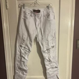 Distressed white skinny jeans